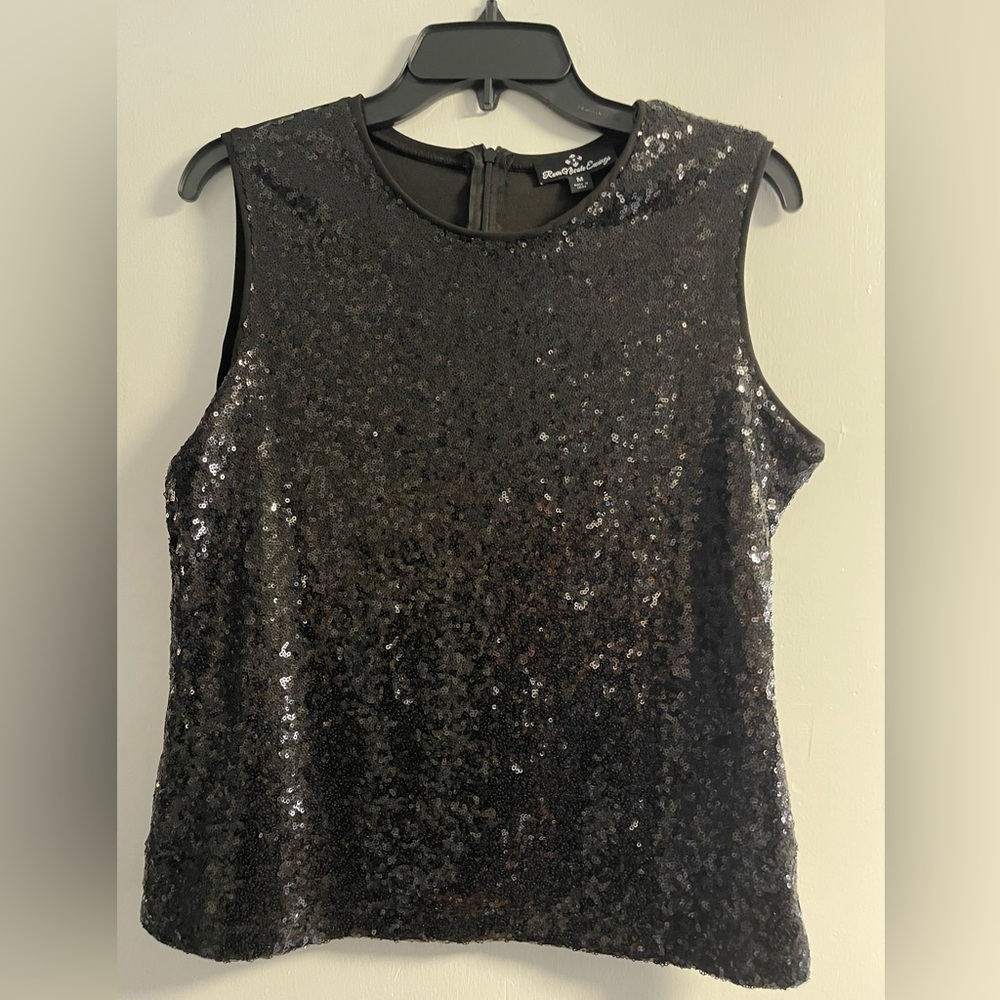 Women’s festive black short sleeved top. Size M.